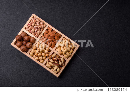 A mix of cashews, pistachios, almonds, macadamia and hazelnuts. Nuts as a food background A mix of cashews, pistachios, almonds, macadamia and hazelnuts. Nuts as a food background 138089154