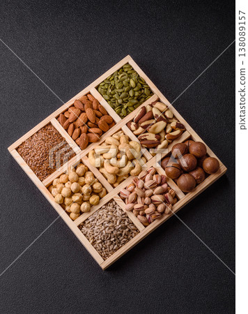 A mix of cashews, pistachios, almonds, macadamia and hazelnuts. Nuts as a food background A mix of cashews, pistachios, almonds, macadamia and hazelnuts. Nuts as a food background 138089157