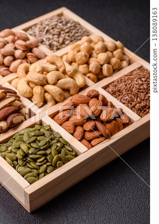 A mix of cashews, pistachios, almonds, macadamia and hazelnuts. Nuts as a food background A mix of cashews, pistachios, almonds, macadamia and hazelnuts. Nuts as a food background 138089163