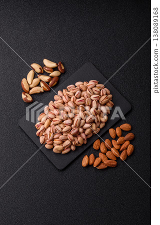 Salted pistachio nuts in shells as a healthy, high calorie food ingredient. Pistachio nuts 138089168