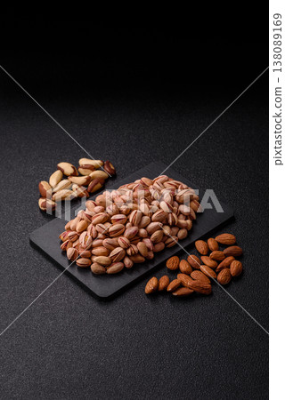 Salted pistachio nuts in shells as a healthy, high calorie food ingredient. Pistachio nuts 138089169