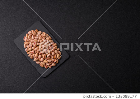 Salted pistachio nuts in shells as a healthy, high calorie food ingredient. Pistachio nuts 138089177