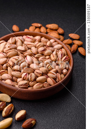 Salted pistachio nuts in shells as a healthy, high calorie food ingredient. Pistachio nuts 138089187
