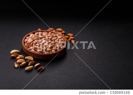 Salted pistachio nuts in shells as a healthy, high calorie food ingredient. Pistachio nuts Salted pistachio nuts in shells as a healthy, high calorie food ingredient. Pistachio nuts 138089188