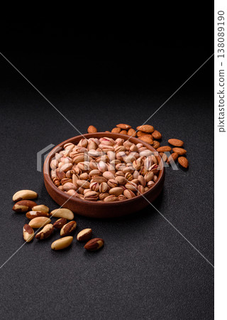 Salted pistachio nuts in shells as a healthy, high calorie food ingredient. Pistachio nuts Salted pistachio nuts in shells as a healthy, high calorie food ingredient. Pistachio nuts 138089190