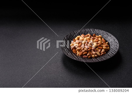 A mix of cashews, pistachios, almonds, macadamia and hazelnuts. Nuts as a food background 138089204