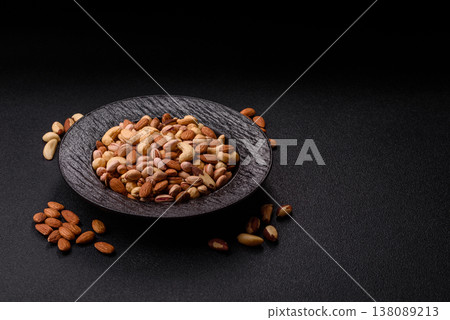 A mix of cashews, pistachios, almonds, macadamia and hazelnuts. Nuts as a food background A mix of cashews, pistachios, almonds, macadamia and hazelnuts. Nuts as a food background 138089213