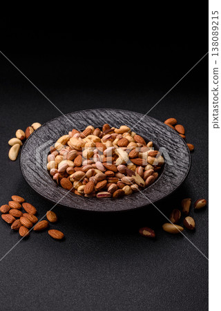 A mix of cashews, pistachios, almonds, macadamia and hazelnuts. Nuts as a food background A mix of cashews, pistachios, almonds, macadamia and hazelnuts. Nuts as a food background 138089215