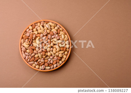 A mix of cashews, pistachios, almonds, macadamia and hazelnuts. Nuts as a food background 138089227