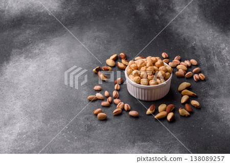 Whole peeled hazelnuts, roasted or raw, as an ingredient for healthy food. Hazelnuts as a background Whole peeled hazelnuts, roasted or raw, as an ingredient for healthy food. Hazelnuts as a background 138089257