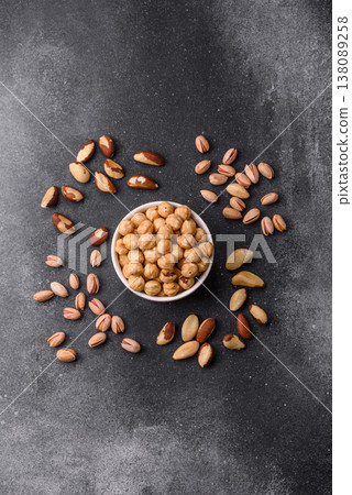 Whole peeled hazelnuts, roasted or raw, as an ingredient for healthy food. Hazelnuts as a background Whole peeled hazelnuts, roasted or raw, as an ingredient for healthy food. Hazelnuts as a background 138089258