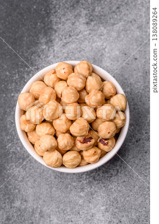 Whole peeled hazelnuts, roasted or raw, as an ingredient for healthy food. Hazelnuts as a background Whole peeled hazelnuts, roasted or raw, as an ingredient for healthy food. Hazelnuts as a background 138089264