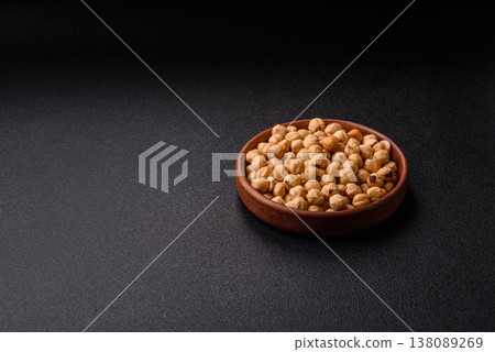 Whole peeled hazelnuts, roasted or raw, as an ingredient for healthy food. Hazelnuts as a background 138089269