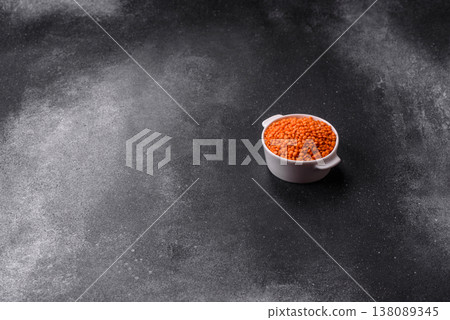 Raw red lentils as a source of protein for a healthy vegan meal. Red lentils Raw red lentils as a source of protein for a healthy vegan meal. Red lentils 138089345