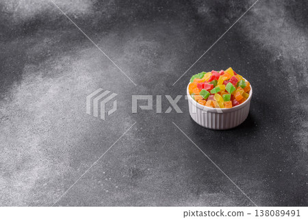 Candied fruit in colorful cubes as an ingredient for baked goods and sweets. Candied fruit Candied fruit in colorful cubes as an ingredient for baked goods and sweets. Candied fruit 138089491
