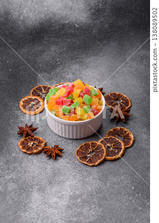 Candied fruit in colorful cubes as an ingredient for baked goods and sweets. Candied fruit Candied fruit in colorful cubes as an ingredient for baked goods and sweets. Candied fruit 138089502