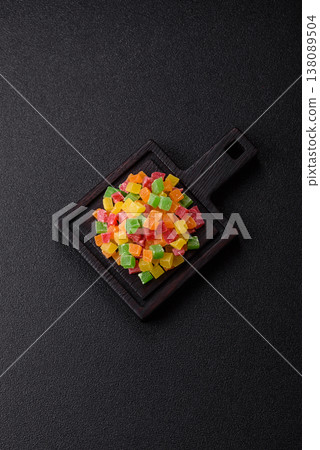 Candied fruit in colorful cubes as an ingredient for baked goods and sweets. Candied fruit 138089504