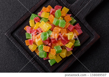 Candied fruit in colorful cubes as an ingredient for baked goods and sweets. Candied fruit Candied fruit in colorful cubes as an ingredient for baked goods and sweets. Candied fruit 138089507