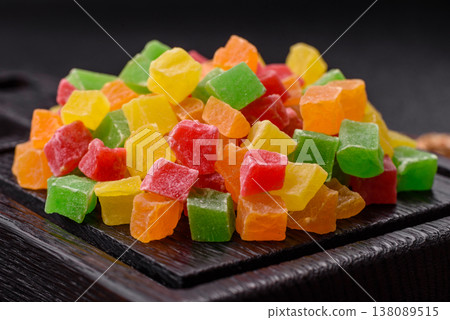 Candied fruit in colorful cubes as an ingredient for baked goods and sweets. Candied fruit Candied fruit in colorful cubes as an ingredient for baked goods and sweets. Candied fruit 138089515