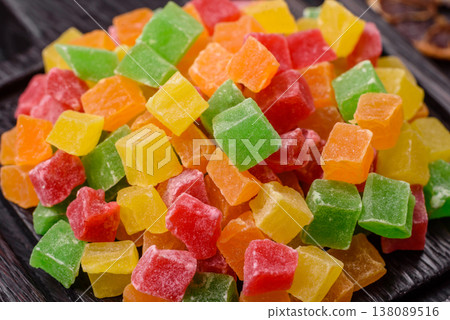 Candied fruit in colorful cubes as an ingredient for baked goods and sweets. Candied fruit Candied fruit in colorful cubes as an ingredient for baked goods and sweets. Candied fruit 138089516