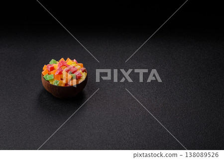 Candied fruit in colorful cubes as an ingredient for baked goods and sweets. Candied fruit Candied fruit in colorful cubes as an ingredient for baked goods and sweets. Candied fruit 138089526