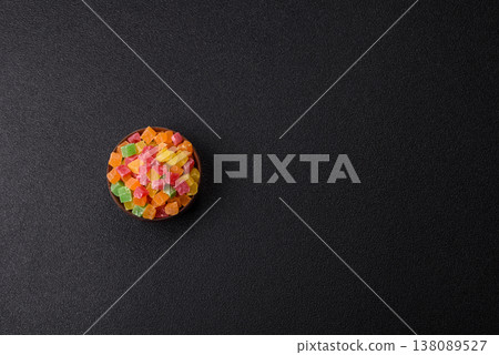 Candied fruit in colorful cubes as an ingredient for baked goods and sweets. Candied fruit Candied fruit in colorful cubes as an ingredient for baked goods and sweets. Candied fruit 138089527