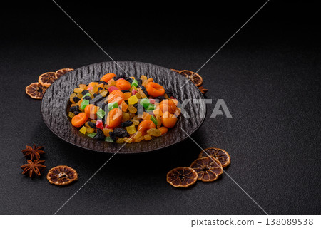 Dried apricots, raisins, and candied fruits as ingredients for baked goods and sweets. Dried fruits Dried apricots, raisins, and candied fruits as ingredients for baked goods and sweets. Dried fruits 138089538