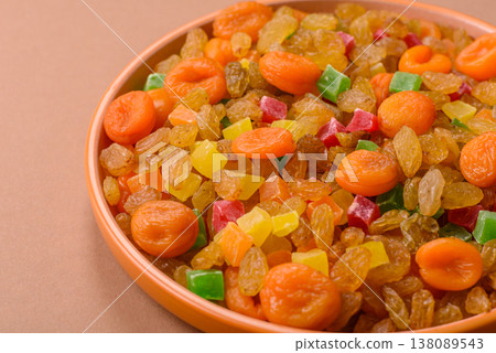 Dried apricots, raisins, and candied fruits as ingredients for baked goods and sweets. Dried fruits Dried apricots, raisins, and candied fruits as ingredients for baked goods and sweets. Dried fruits 138089543