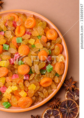 Dried apricots, raisins, and candied fruits as ingredients for baked goods and sweets. Dried fruits Dried apricots, raisins, and candied fruits as ingredients for baked goods and sweets. Dried fruits 138089547