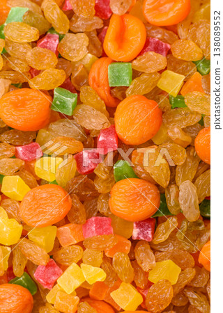 Dried apricots, raisins, and candied fruits as ingredients for baked goods and sweets. Dried fruits Dried apricots, raisins, and candied fruits as ingredients for baked goods and sweets. Dried fruits 138089552