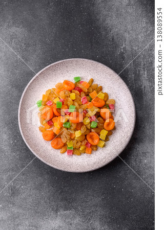 Dried apricots, raisins, and candied fruits as ingredients for baked goods and sweets. Dried fruits Dried apricots, raisins, and candied fruits as ingredients for baked goods and sweets. Dried fruits 138089554