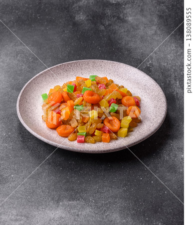 Dried apricots, raisins, and candied fruits as ingredients for baked goods and sweets. Dried fruits Dried apricots, raisins, and candied fruits as ingredients for baked goods and sweets. Dried fruits 138089555