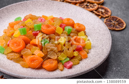 Dried apricots, raisins, and candied fruits as ingredients for baked goods and sweets. Dried fruits Dried apricots, raisins, and candied fruits as ingredients for baked goods and sweets. Dried fruits 138089559