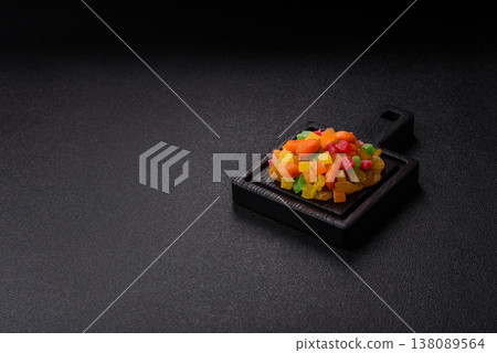 Dried apricots, raisins, and candied fruits as ingredients for baked goods and sweets. Dried fruits Dried apricots, raisins, and candied fruits as ingredients for baked goods and sweets. Dried fruits 138089564