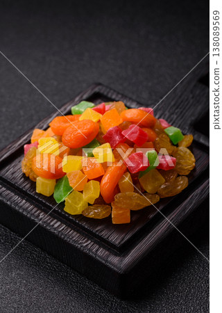 Dried apricots, raisins, and candied fruits as ingredients for baked goods and sweets. Dried fruits Dried apricots, raisins, and candied fruits as ingredients for baked goods and sweets. Dried fruits 138089569