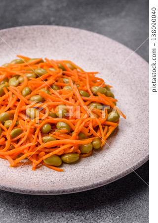 Asian salad with edamame beans, carrots, tofu, and spices. Edamame and carrot salad Asian salad with edamame beans, carrots, tofu, and spices. Edamame and carrot salad 138090040