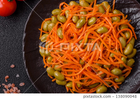Asian salad with edamame beans, carrots, tofu, and spices. Edamame and carrot salad Asian salad with edamame beans, carrots, tofu, and spices. Edamame and carrot salad 138090048