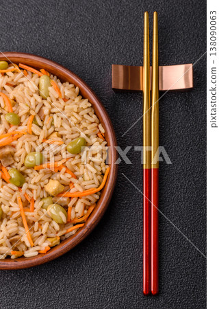 Asian food with rice, edamame, carrots, tofu, and spices. Rice with edamame and carrots Asian food with rice, edamame, carrots, tofu, and spices. Rice with edamame and carrots 138090063