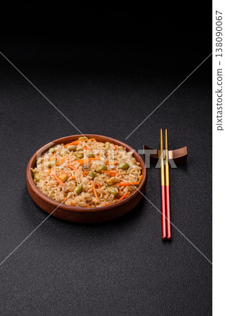 Asian food with rice, edamame, carrots, tofu, and spices. Rice with edamame and carrots Asian food with rice, edamame, carrots, tofu, and spices. Rice with edamame and carrots 138090067