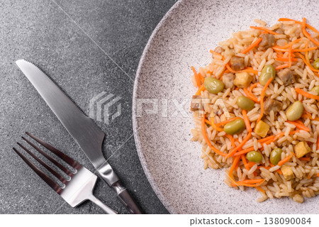Asian food with rice, edamame, carrots, tofu, and spices. Rice with edamame and carrots Asian food with rice, edamame, carrots, tofu, and spices. Rice with edamame and carrots 138090084