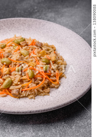 Asian food with rice, edamame, carrots, tofu, and spices. Rice with edamame and carrots Asian food with rice, edamame, carrots, tofu, and spices. Rice with edamame and carrots 138090088