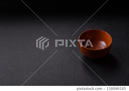 An empty round brown wooden bowl for Asian food. An empty wooden bowl An empty round brown wooden bowl for Asian food. An empty wooden bowl 138090185
