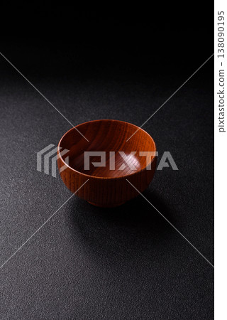 An empty round brown wooden bowl for Asian food. An empty wooden bowl 138090195