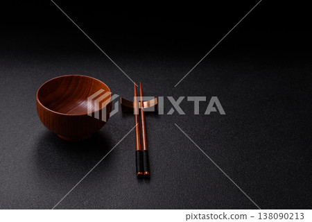 An empty round brown wooden bowl for Asian food. An empty wooden bowl An empty round brown wooden bowl for Asian food. An empty wooden bowl 138090213