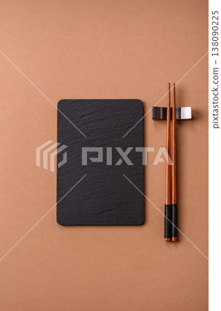 Wooden bamboo chopsticks for sushi and other Asian food with a blank background. Wooden chopsticks Wooden bamboo chopsticks for sushi and other Asian food with a blank background. Wooden chopsticks 138090225