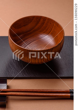 An empty round brown wooden bowl for Asian food. An empty wooden bowl 138090229