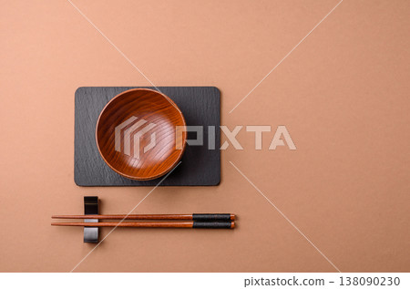 An empty round brown wooden bowl for Asian food. An empty wooden bowl An empty round brown wooden bowl for Asian food. An empty wooden bowl 138090230
