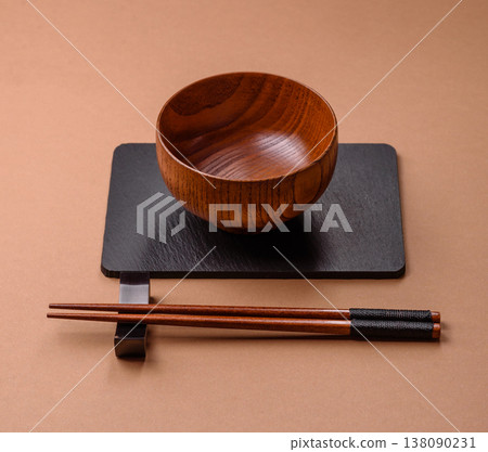 An empty round brown wooden bowl for Asian food. An empty wooden bowl An empty round brown wooden bowl for Asian food. An empty wooden bowl 138090231