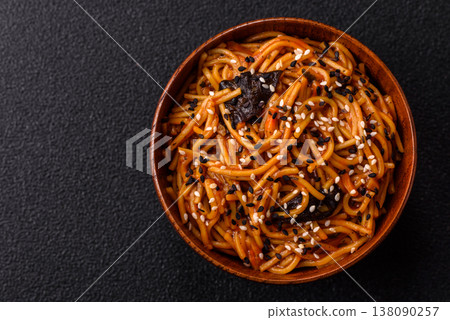 Yakisoba, Asian noodles with vegetables and meat, is a Japanese spicy food. Yakisoba or udon Yakisoba, Asian noodles with vegetables and meat, is a Japanese spicy food. Yakisoba or udon 138090257