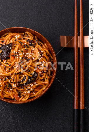 Yakisoba, Asian noodles with vegetables and meat, is a Japanese spicy food. Yakisoba or udon Yakisoba, Asian noodles with vegetables and meat, is a Japanese spicy food. Yakisoba or udon 138090260